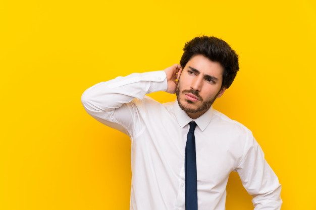 businessman-isolated-yellow-wall-having-doubts-with-confuse-face-expression_1368-45626